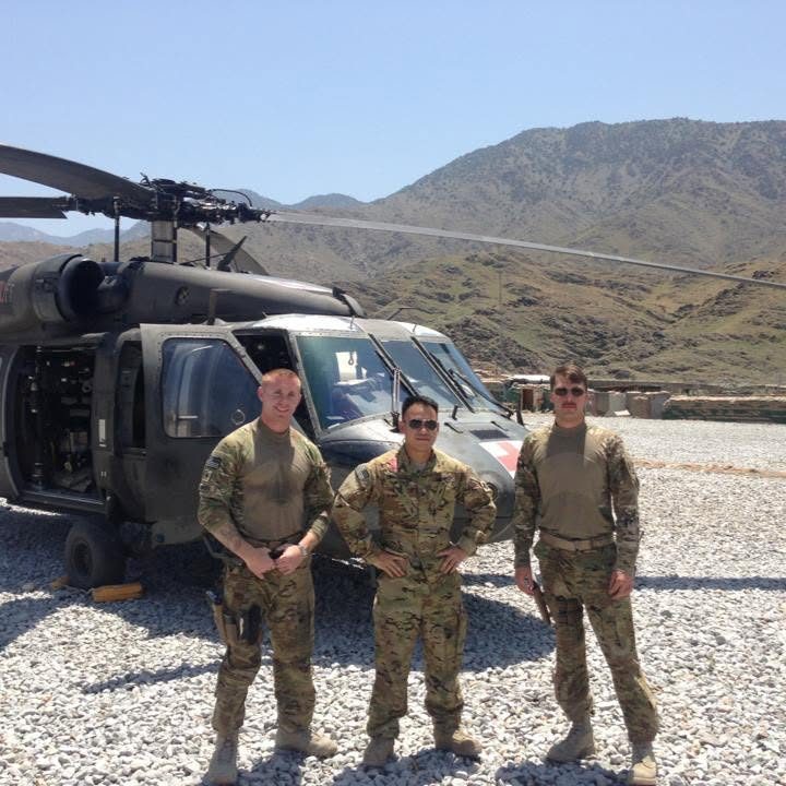 Rob and crew in front of a Black Hawk in Afghanistan